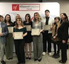students holding award
