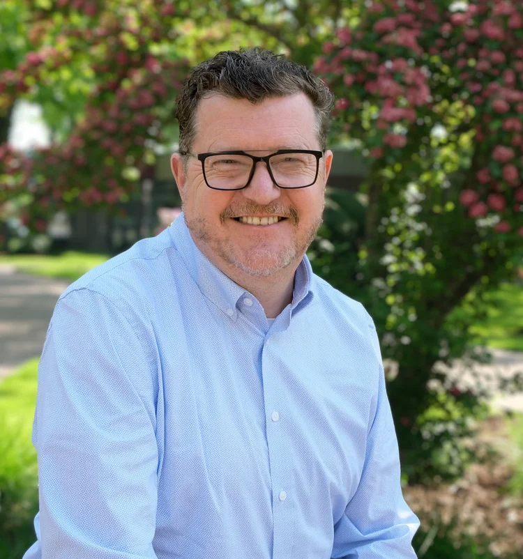 Tom Brophy posing for a photo outdoors
