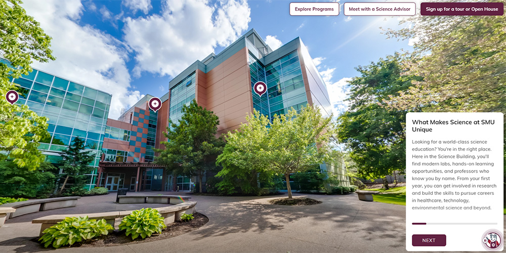 The Science Building with large leafy trees in front.